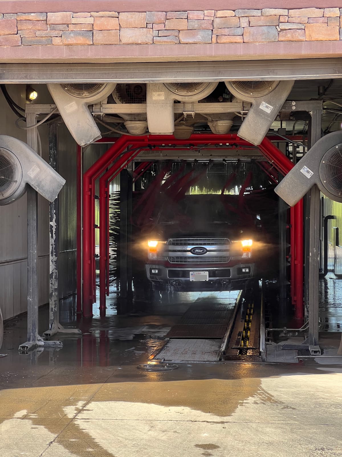 Car going through Rowley's Platinum Car Wash tunnel in Washington, Utah