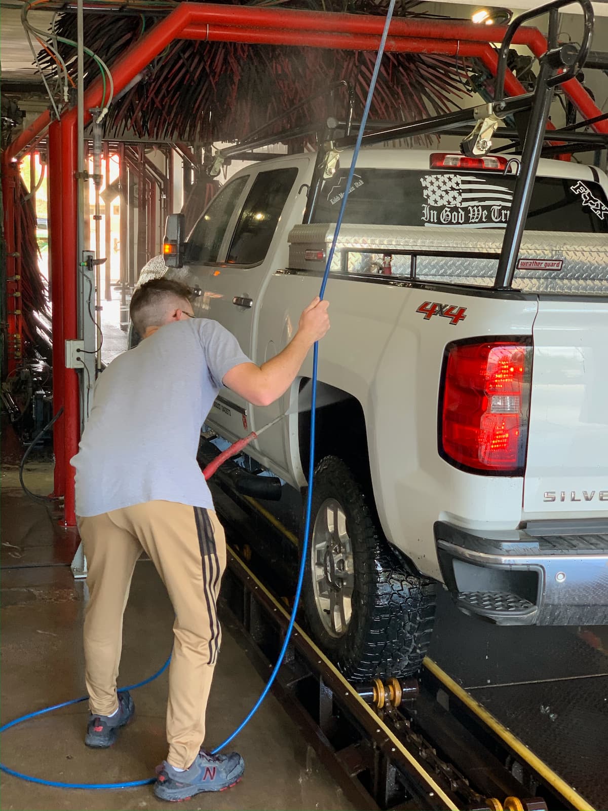 Muddy wheel wells being cleaned at Rowley's Platinum Car Wash in Southern Utah
